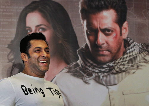 FILE - In this Sunday, Aug. 12, 2012 file photo, Bollywood actor Salman Khan smiles as he stands in front of a poster showing himself and actress Katrina Kaif at a press conference to promote the film 'Ek Tha Tiger' or 'Once There was a Tiger', in New Delhi, India. A Mumbai court ruled that Khan will be tried for homicide for his alleged involvement in a fatal road accident more than 10 years ago. If convicted he faces up to 10 years in jail. The trial will begin on July 19. AP photo