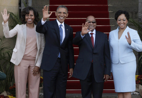 U.S. President Barack Obama (2nd L) and First Lady Michelle Obama (L) wave next to South Africa's President Jacob Zuma (2nd R) and his wife, First Lady Thobeka Madiba-Zuma, at the Union Building in Pretoria, June 29, 2013. Obama paid tribute to anti-apartheid hero Nelson Mandela as he flew to South Africa on Friday but played down expectations of a meeting with the ailing black leader during an Africa tour promoting democracy and food security. REUTERS