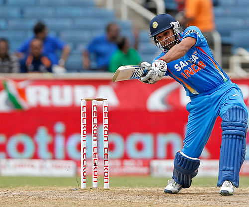 Rohit Sharma plays a shot during the Tri-Nation Series cricket match against West Indies in Kingston, Jamaica, Sunday, June 30, 2013. AP Photo