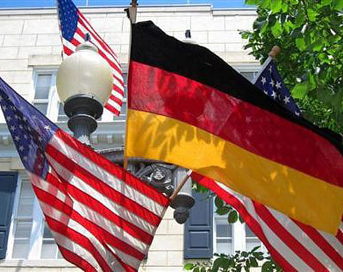 American and German flags hang together at Blair House across from the White House in Washington June 6, 2011. File Photo-Reuters