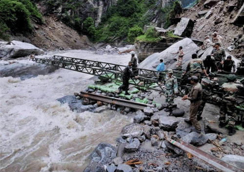 Border Road Organisation and army personnel launch a new bridge over Alaknanda at Lambagar in Uttarakhand recently. PTI Photo