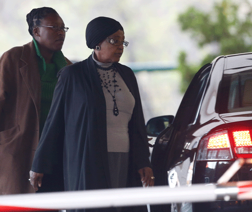 Winnie Madikizela-Mandela, right, ex-wife of former South African President Nelson Mandela arrives at the Mediclinic Heart Hospital where Mandela is being treated in Pretoria, South Africa, Sunday, June 30, 2013. (AP Photo)