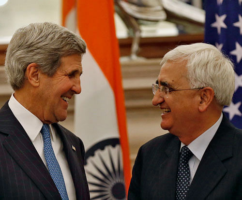 U.S. Secretary of State John Kerry (L) and India's Foreign Minister Salman Khurshid smile during their joint news conference in New Delhi June 24, 2013. India sought to play down reports of the US cyber snooping at diplomatic missions, sayingissue was discussed during the visit of  John Kerry here last week. Reuters