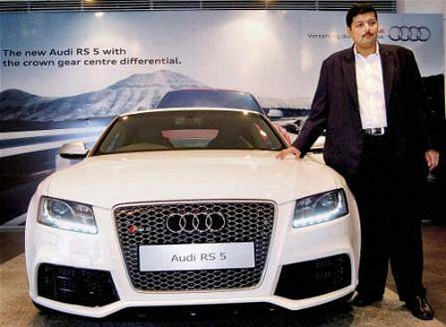 Rajiv M Sanghvi, managing director, Audi Hyderabad, unveils Audi RS 5 Coupe in Hyderabad on Tuesday. (PTI Photo)