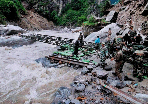 : Border Road Organisation and army personnel launch a new bridge over Alaknanda at Lambagar in Uttarakhand recently. PTI Photo