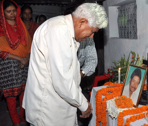 Father of slain Superintendent of Police of Pakur district, Amarjit Balihar, who was killed in a Maoist attack, paying homage to him at his residence in Ranchi, Jharkhand, Tuesday. Maoist rebels attacked convoy, killing superintendent of police and five other policemen. PTI Photo