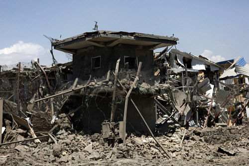 A view of a damaged security tower at the site of a suicide attack in Kabul July 2, 2013. Taliban insurgents including a suicide bomber in a truck killed six people in the attack on a foreign logistics and supply company in Kabul on Tuesday. REUTERS