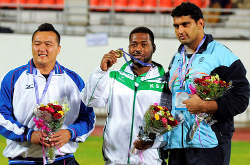 Om Prakash of India (R) won the first Bronze medal in the Shot Put, Sultan Abdul Majeed of Saudi Arabia won the gold (C) and Chang Ming Huan the silver medalist in the 20th Asian Athletics Championships at the Balewadi Stadium in Pune on Wednesday. PTI Photo