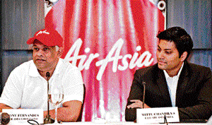 Air Asia CEO Tony Fernandes (left) with Air Asia India CEO Mitu Chandilya in New Delhi on Wednesday. AFP