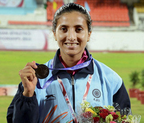 Mayookha Johny shows her Bronze medal in the long Jump during the first day of the 20th Asian Atheletics Championships at the Balewadi Stadium in Pune on Wednesday. PTI Photo