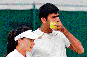 strategic time Rohan Bopanna and his Chinese partner Jie Zheng during their pre-quarterfinal win in the mixed doubles event on Tuesday. afp