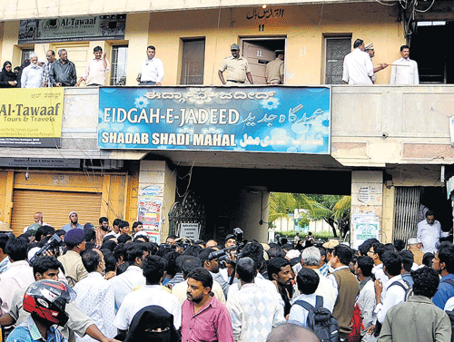 shocking incident: People gather outside the office of the Urdu weekly, run by  Hafiz Shamsul Huda, on Tannery Road on Wednesday. dh Photos