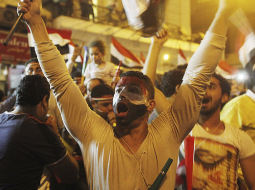 Anti-Mursi protesters chant as they celebrate near Tahrir square after the announcement of the removal from office of Egypt's deposed President Mohamed Mursi in Cairo, July 3, 2013. Mursi, toppled by the military on Wednesday, is being held by the authorities, a Muslim Brotherhood spokesman and a security official said on Thursday. REUTERS