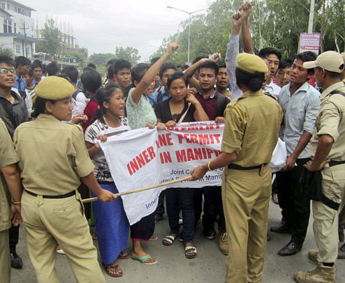 Student's Wing of Inner Line Permit (ILP) Demand Committee of Manipur in a tussle with police personnel during a demonstration against government in Imphal on Thursday. PTI Photo