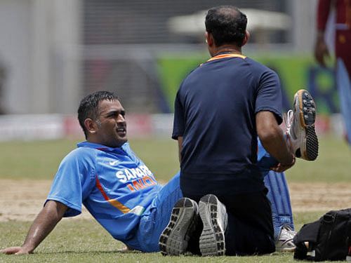 Dhoni (in pic) was ruled out of the series in the West Indies due to a hamstring injury and it is not known if he will be available for the series against Zimbabwe commencing, July 24.  AP Photo