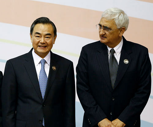China's Foreign Minister Wang Yi (left) and External Affairs Minister Salman Khurshid during the 3rd East Asia Summit (EAS) in Bandar, Seri Begawan, Brunei. AP File photo