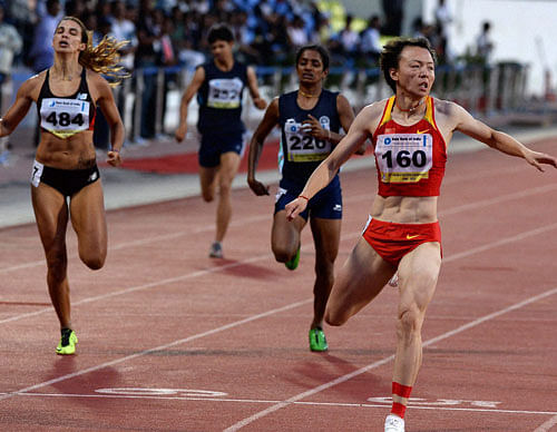 Zhao Yanmin of China, Poovamma of India and Taslakian Gretta winner of the the gold and silver and bronze medals in the Asian Athletics Championships in Pune on Thursday. PTI Photo
