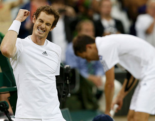 Andy Murray of Britain celebrates after defeating Jerzy Janowicz of Poland in their men's semi-final tennis match at the Wimbledon Tennis Championships, in London July 5, 2013. REUTERS