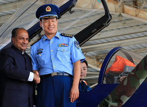Defence Minister A K Antony at a Chinese fighter aircraft at China's 24 airbase in Tianjin on Saturday. PTI Photo