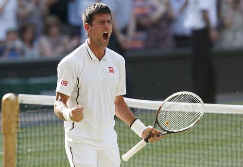 Novak Djokovic of Serbia celebrates after defeating Juan Martin del Potro of Argentina in their men's semi-final tennis match at the Wimbledon Tennis Championships, in London July 5, 2013. REUTERS