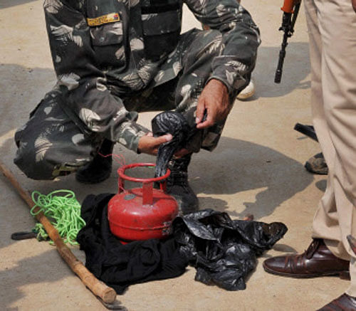 Security personnel detonating a cane bomb, recovered from Buddhist Tergar Monastery at World Heritage Mahabodhi Temple in Bodhgaya on Sunday. PTI Photo