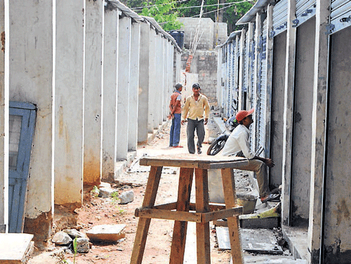 The temporary building being constructed to relocate  vendors at Malleswaram market. DH Photo