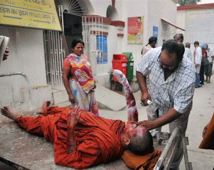 A Buddhist monk being treated after he was injured in an explosion in Mahabodhi Temple campus at Bodhgaya on Sunday. Nine serial explosions today rocked the internationally renowned temple town of Bodh Gaya. PTI Photo