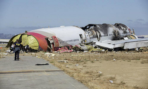 U.S. National Transportation Safety Board (NTSB) photo shows the wreckage of Asiana Airlines Flight 214 that crashed at San Francisco International Airport in San Francisco, California in this handout released on July 7, 2013. The Asiana Airlines Boeing 777 that crashed at San Francisco's airport on Saturday was traveling 'significantly below' its intended speed and its crew tried to abort the landing just seconds before it hit the seawall in front of the runway, the U.S. National Transportation Safety Board said on Sunday. REUTERS