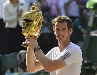 Andy Murray of Britain holds the winners trophy after defeating Novak Djokovic of Serbia in their men's singles final tennis match at the Wimbledon Tennis Championships, in London July 7, 2013.  Credit: Reuters