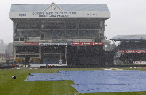 The Brian Lara Pavilion of the Queen's Park Oval is shown almost empty as rain falls during the cricket match between the West Indies and Sri Lanka of the Tri-Nation Series in Port-of-Spain, Trinidad, Sunday, July 7, 2013. Persistent rain meant that play was called off after only 19 overs were bowled during Sri Lanka's innings and it will continue from the current state on the reserve day on Monday. (AP Photo