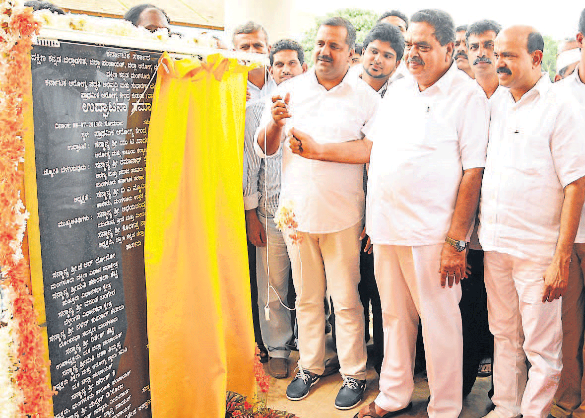 Health and Family Welfare Minister U T Khader inaugurates the new building of Primary Health Centre at Kudupu, on the outskirts of Mangalore, on Monday.  District-in-Charge Minister Ramanath Rai, MLA Mohiyudin Bava and others look on. dh photo