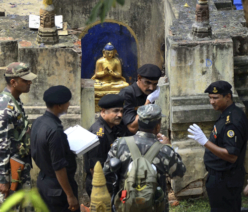 NSG and NIA experts collecting samples at Mahabodhi Mahavihara in Bodhgaya on Monday, a day after serial blasts in the temple. PTI Photo