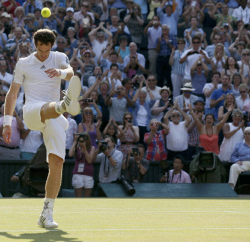 Andy Murray of Britain reacts as he defeats Novak Djokovic of Serbia in their men's singles final tennis match at the Wimbledon Tennis Championships, in London July 7, 2013. REUTERS