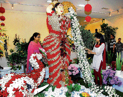 impressed: Visitors at the artificial flower exhibition.