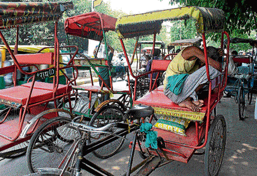 no work:  Pedal rickshaw-pullers are losing business.