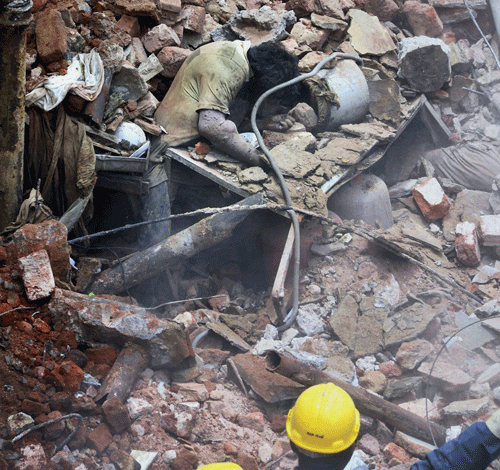 National Disaster Response Team (NDRT) carry out rescue operation at the site of collapsed hotel building in Secunderabad on Tuesday. PTI Photo