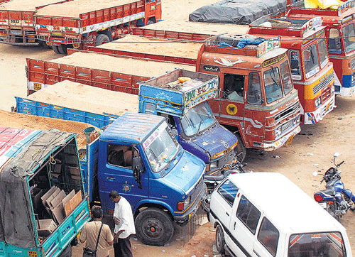 Sand-laden trucks parked at Banashankari 2nd Stage on Tuesday, following the indefinite strike by members of the Federation of Karnataka State Lorry Owners' and Agents' Association. KPN