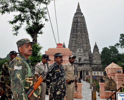 CRPF jawan guard at Mahabodhi Temple premises in Bodhgaya on Monday, a day after serial blasts rocked the temple. PTI Photo