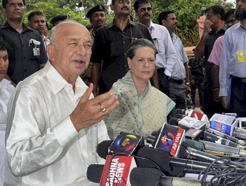 UPA Chairperson Sonia Gandhi along with Union Home Minister Sushil Kumar Shinde talking to media after visiting the Mahabodhi Temple in Bodhgaya on Wednesday. PTI Photo