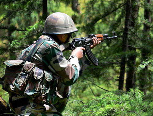 An army soldier takes position during an operation in Keran sector of north Kashmir's Kupwara district on Wednesday to prevent infiltration by militants from across the border. PTI Photo