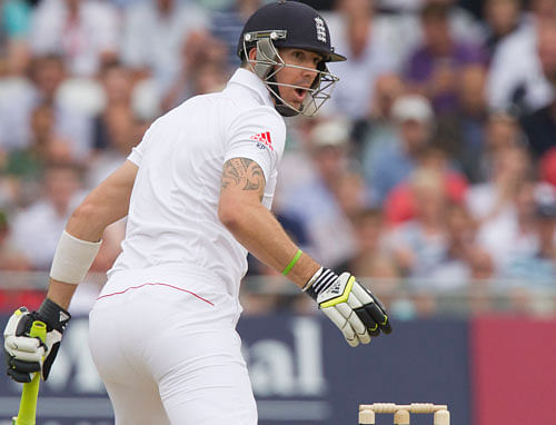 England's Kevin Pietersen reacts as he loses his wicket for 14 off the bowling of Australia's Peter Siddle caught by Brad Haddin during the first day of the opening Ashes series cricket match at Trent Bridge cricket ground, Nottingham, England, Wednesday, July 10, 2013. (AP Photo/Jon Super)