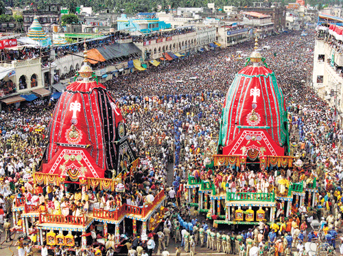 SEA OF PEOPLE: Devotees throng the chariot of Lord Jagannath and Subhadra during the annual Rath Yatra in Puri, on Wednesday. AP