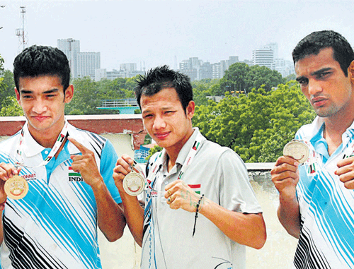 India's medallists at the ASBC Asian Confederation Boxing Championship. (From left) Shiva Thapa, L Devendro Singh, Mandeep Jangra. pti