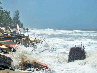 Sea erosion has consumed a private guesthouse near Uchchila in Ullal, Dakshina Kannada district. DH Photo