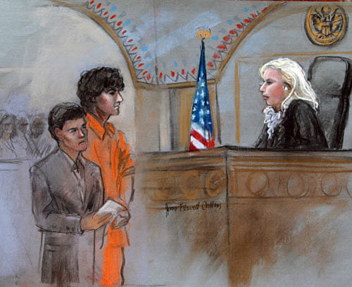 This courtroom sketch depicts Boston Marathon bombing suspect Dzhokhar Tsarnaev standing with his lawyer Miriam Conrad, left, before Magistrate Judge Marianne Bowler, right, during his arraignment in federal court Wednesday, July 10, 2013 in Boston. The 19-year-old has been charged with using a weapon of mass destruction, and could face the death penalty. AP Photo