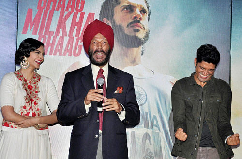 Former athlete Milkha Singh with actors Sonam Kapoor and Farhan Akhtar at the music launch of film "Bhaag Milkha Bhaag" in Mumbai on Wednesday. PTI Photo