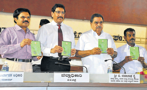 District-in-Charge Minister Ramanath Rai releases the Nirmala Bharath Abhiyan theme song CD prior to the KDP review meeting at Zilla Panchayat hall in Mangalore on Thursday. Deputy Commissioner N Prakash, ZP President Koragappa Naik, CEO K N Vijayaprakash and others look on. dh photo