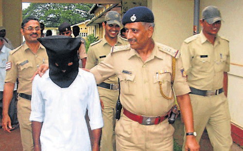 The accused being taken to be produced before the magistrate in Udupi on Thursday. DH photo