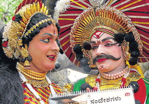 Making a point: Yakshagana artistes hold an awareness  calendar on the occasion of the World Population Day in  Bangalore on Thursday. DH photo