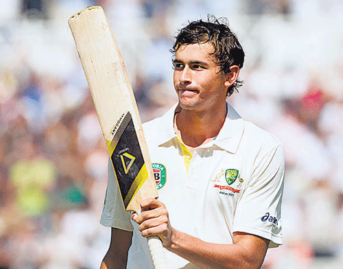Australia's Ashton Agar acknowledges the applause of the crowd after his record-setting knock of 98 on the second day of the opening Ashes series cricket match against England, at Trent Bridge, on Thursday. AP